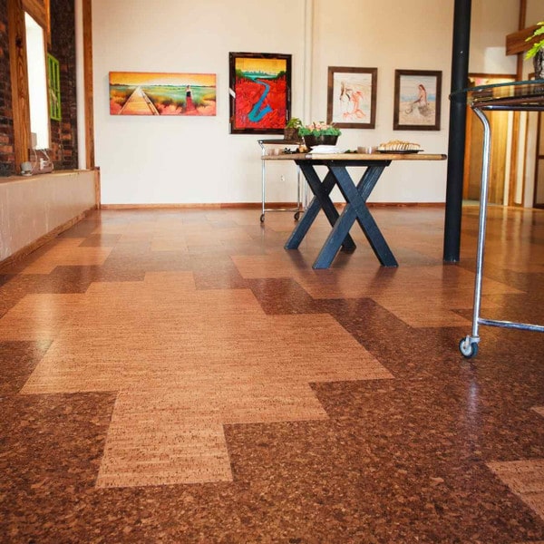 Casablanca and chestnut floating cork flooring in a reception room with art on the walls and a wooden dining table